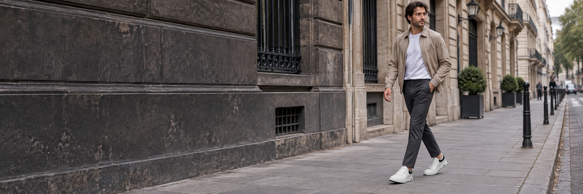 Man wearing white Nora sneakers on a city street